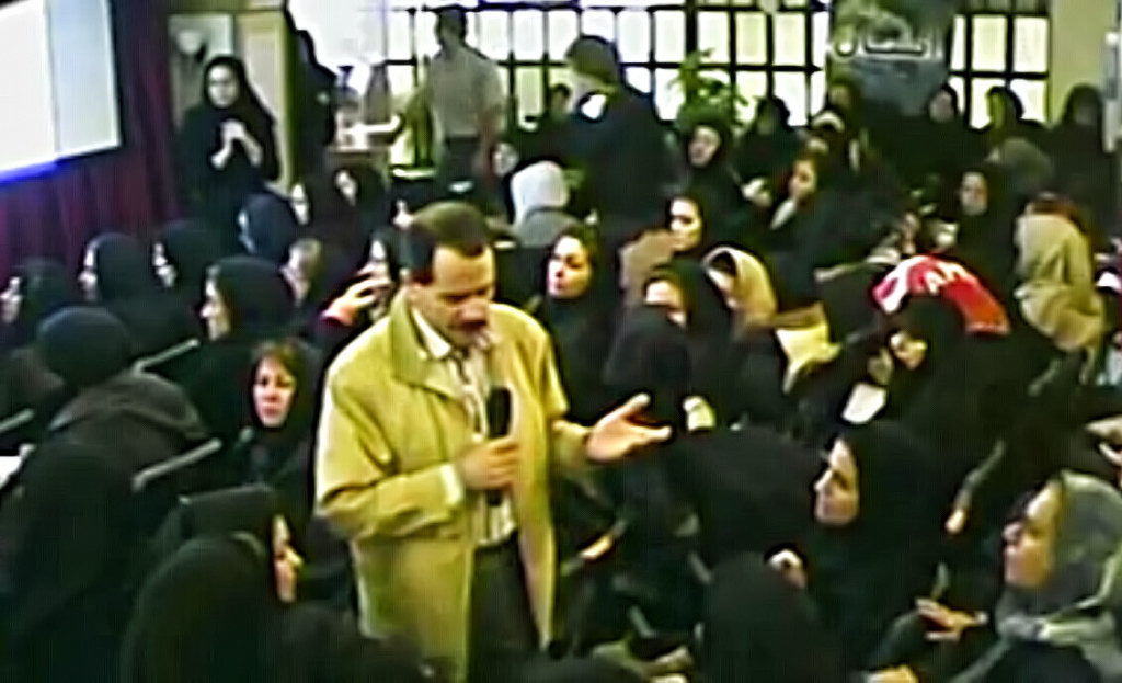 Institute of Interuniversal Mysticism in Gandhi Street, Tehran, Iran. The photo is captured from his video while he is teaching among students.